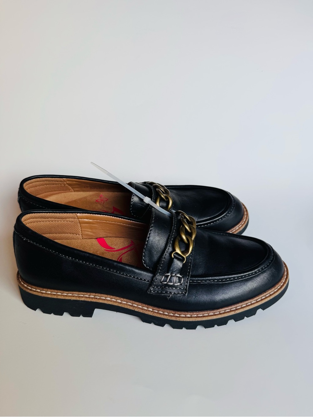 Comfortiva Black Leather Loafers with Gold Chain Accent